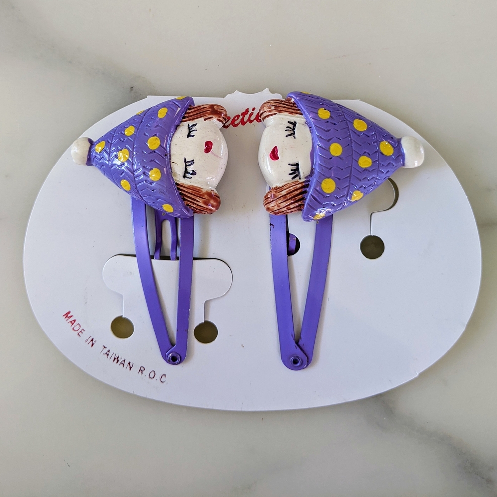 NWOT. Very Cute Purple and Yellow Hair Clips with Yellow Accents.